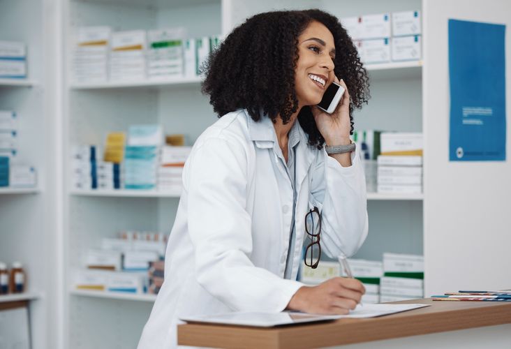 Pharmacist talking on the phone Curbside Pickup