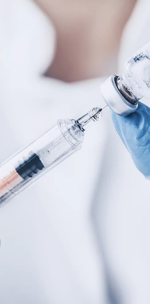 Pharmacist holding injection Injectables