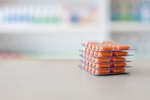 A stack of pill packs Medication Adherence