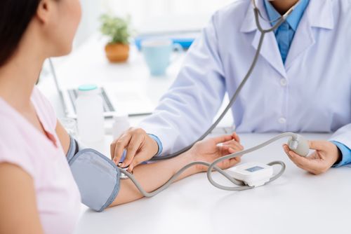 A person has their blood pressure read Health Screenings