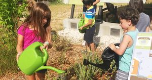 Kids watering plants