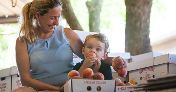 Mary Lightsey and Son with Peaches