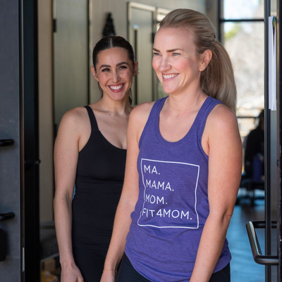 Moms smiling after an exercise class standing outside of the fit for mom exercise studio.png