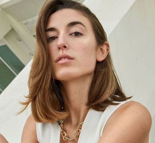 A woman looking down on camera