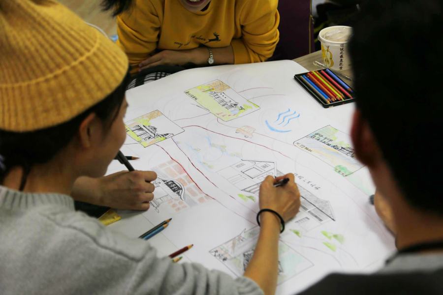 Person drawing a map with colored pencils 5