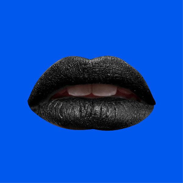 Black lipstick lips cut out and pasted on a bright blue background 5