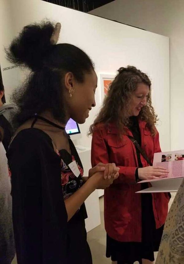 Two women standing next to each other 8