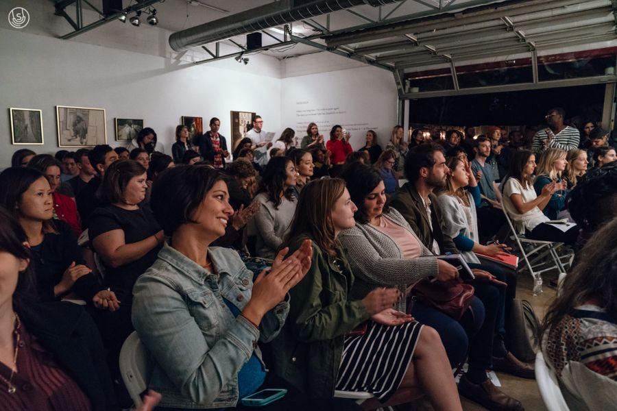 Attendees seated and clapping 4