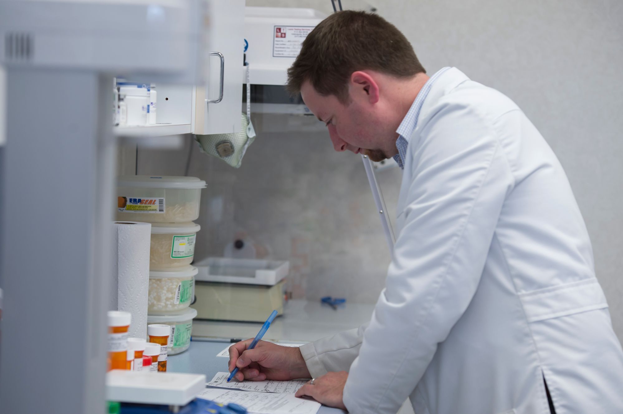 Pharmacist handling medications