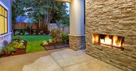 An image of a back yard with a fire pit.