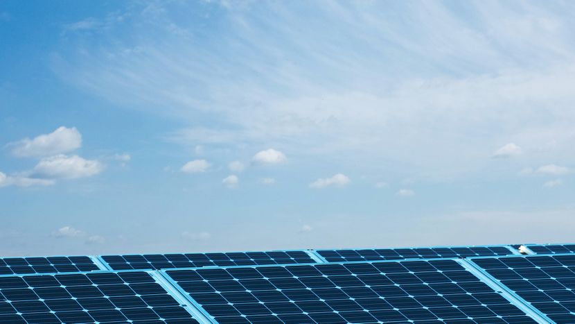 Blue sky behind solar panels