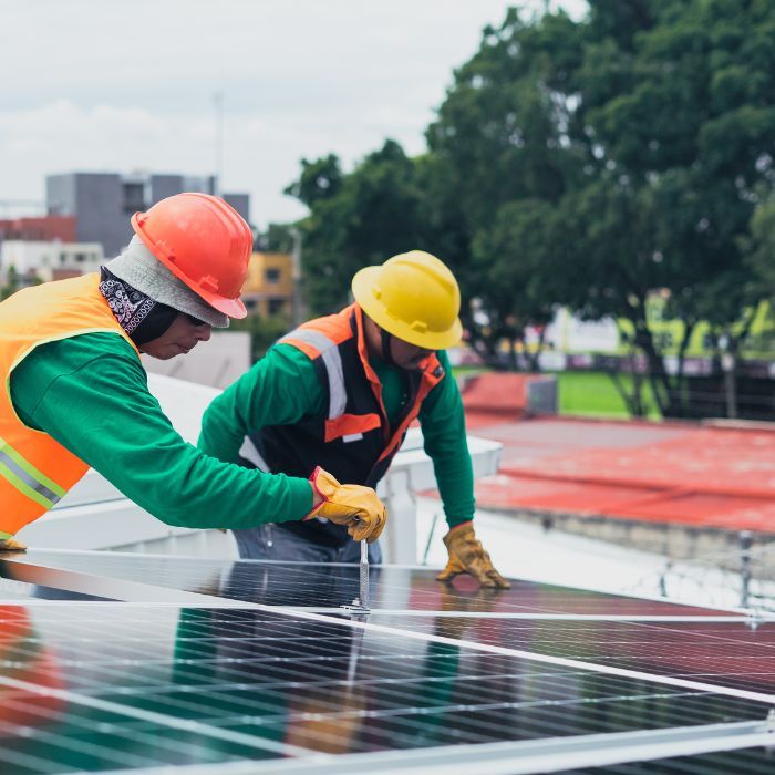 technicians working on solar panel repairs