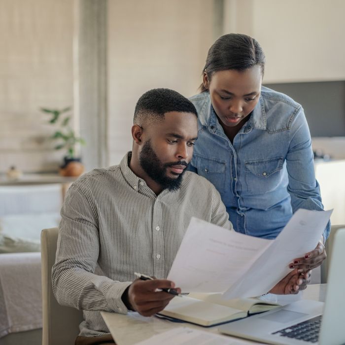 Man and woman looking at their bills