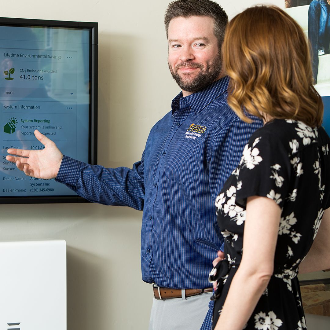 man talking to client about solar energy