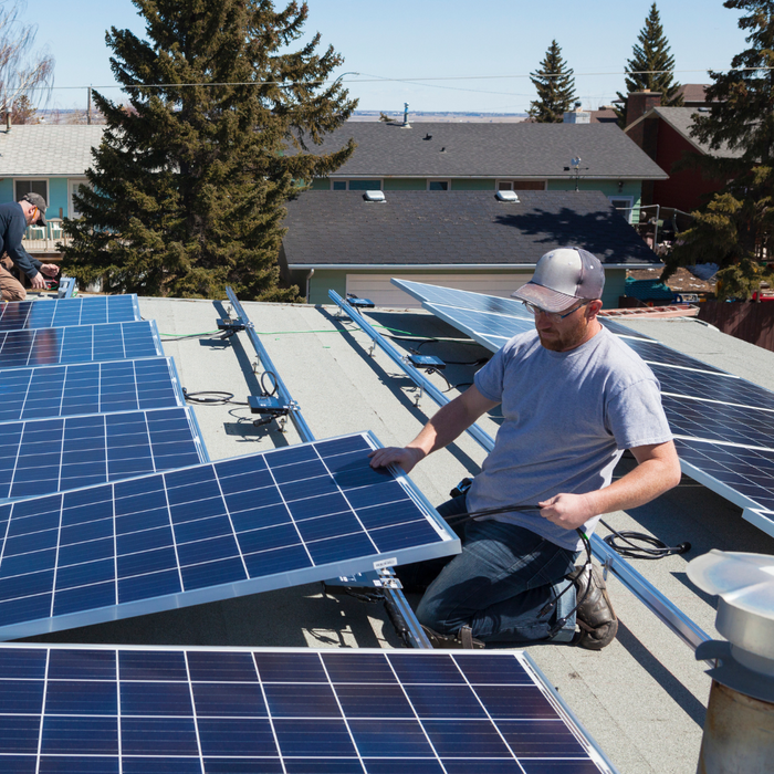 men working on solar panels