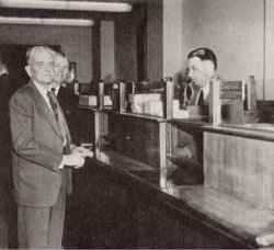 Mr. James C. Case making the first deposit in the Bank of Dade. George H. Harrison, President, looks on while Jack Hill receives the deposit. Bank of Dade History
