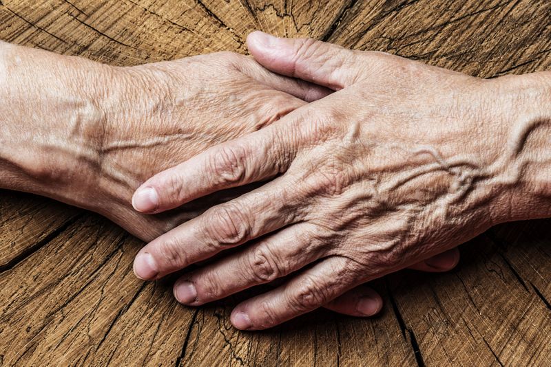 Elderly Couple Holding Hands
