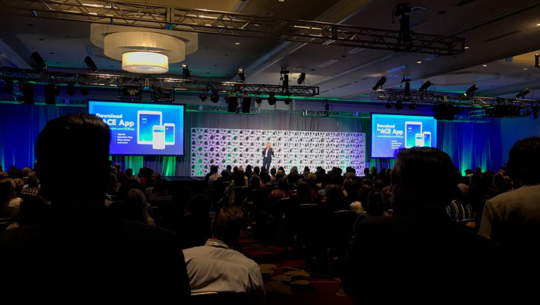 A Large Conference Stage with Two Projection Screens