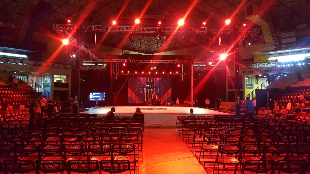 Stage set up with red lighting and an led video wall display