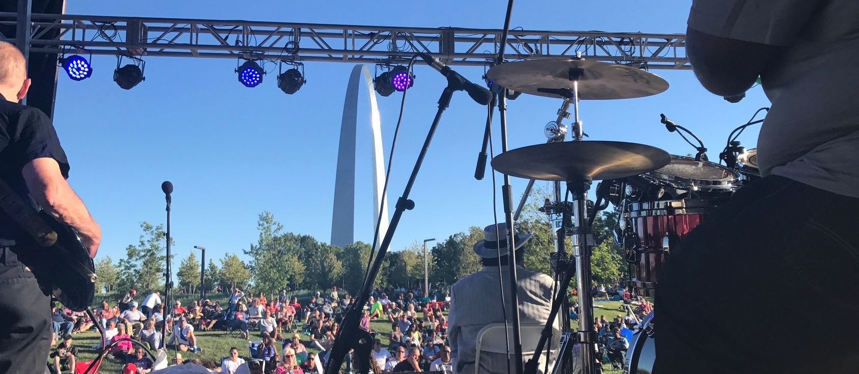 An outdoor concert by the St. Louis Arch