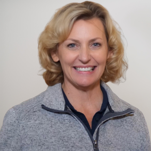 Gina Armstrong Headshot Beige Background.png