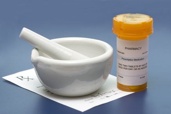 Image of a mortar and pestle with a prescription Compounding