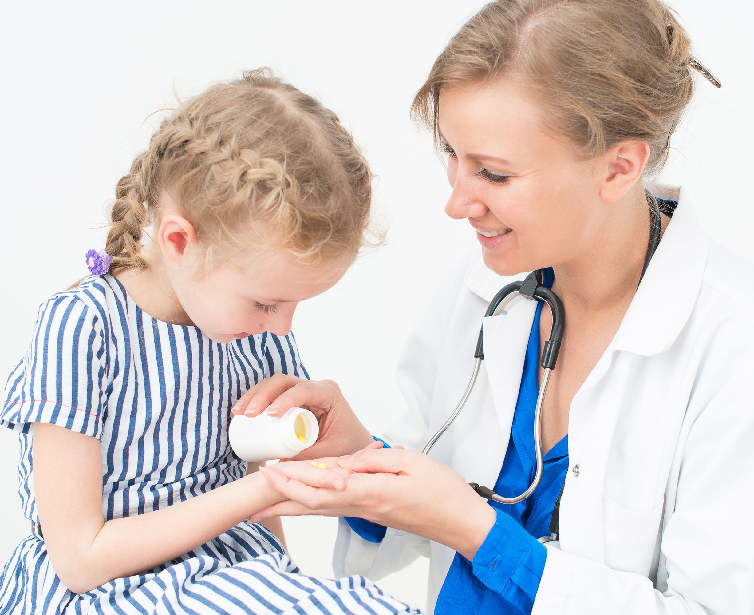 Doctor giving a vitamin to a child Childrens Vitamin Program