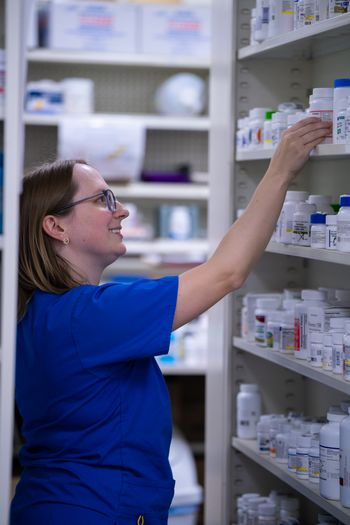 Pharmacy employee working Who We Are