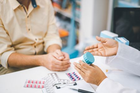 Pharmacist discussing medicine Medication Therapy Management