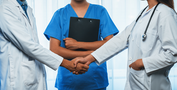 Pharmacy staff members shaking hands Multilingual