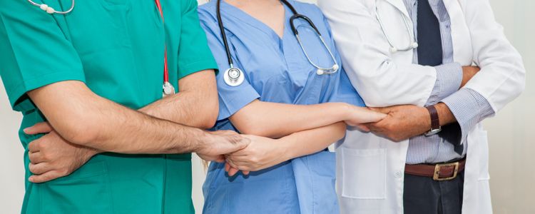 Medical Staff Holding Hands in Unity Community Health Workers