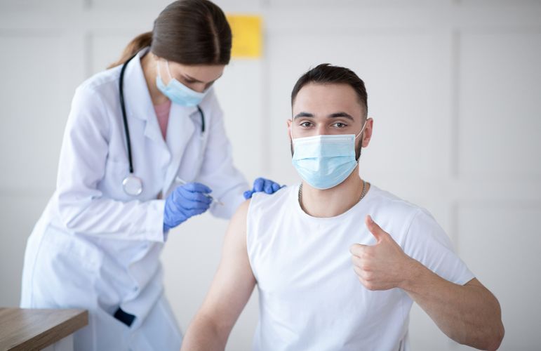 Man receiving a shot Vaccinations