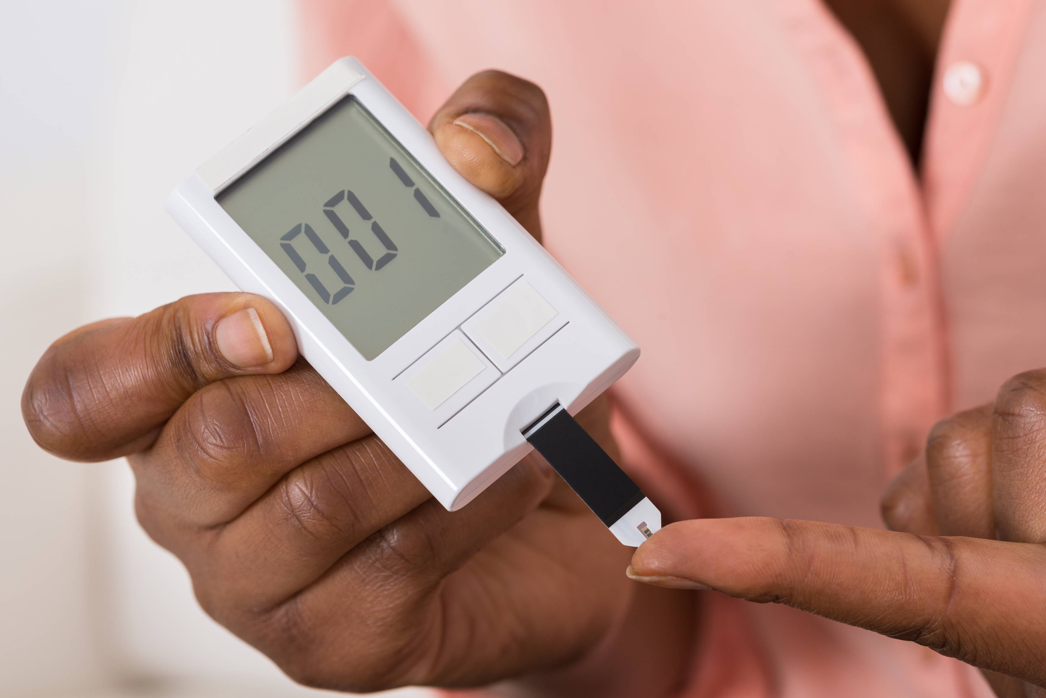 Person testing blood glucose level