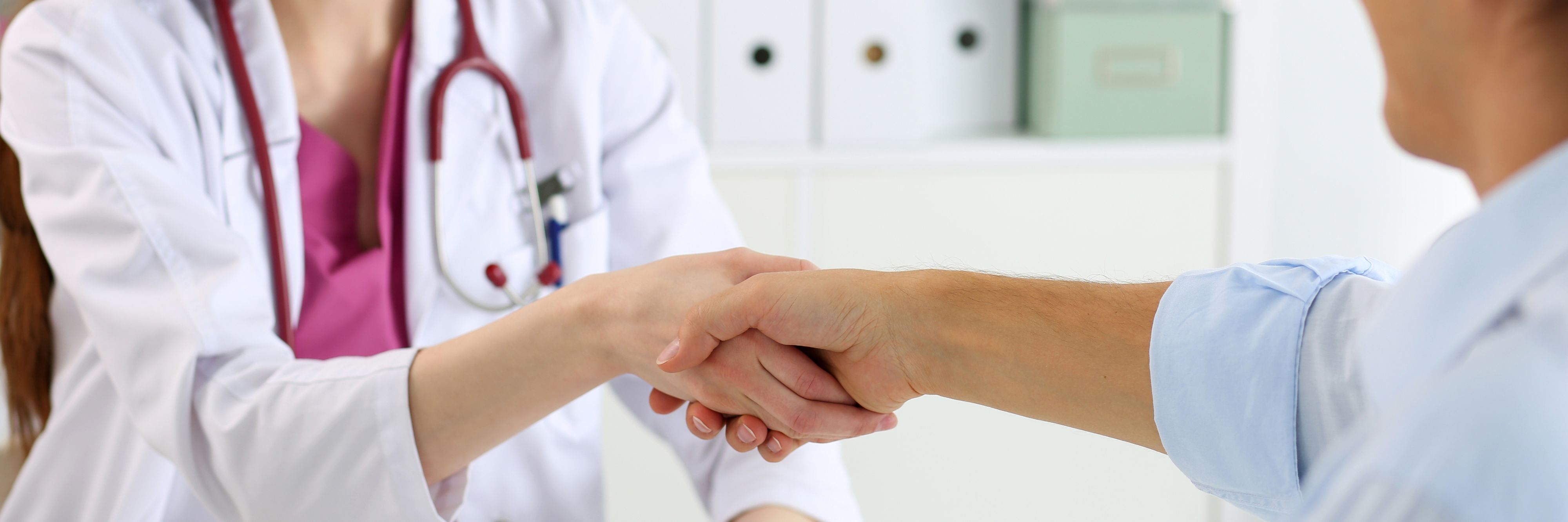 Person shaking hands with a doctor Health Screenings