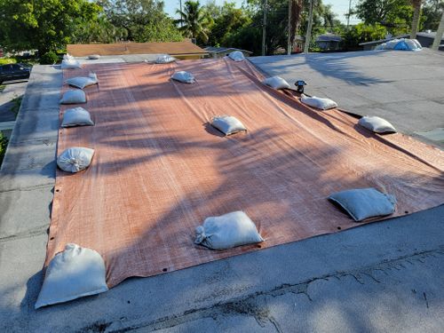 Tarp Covering Roof Leak from Wind Storm