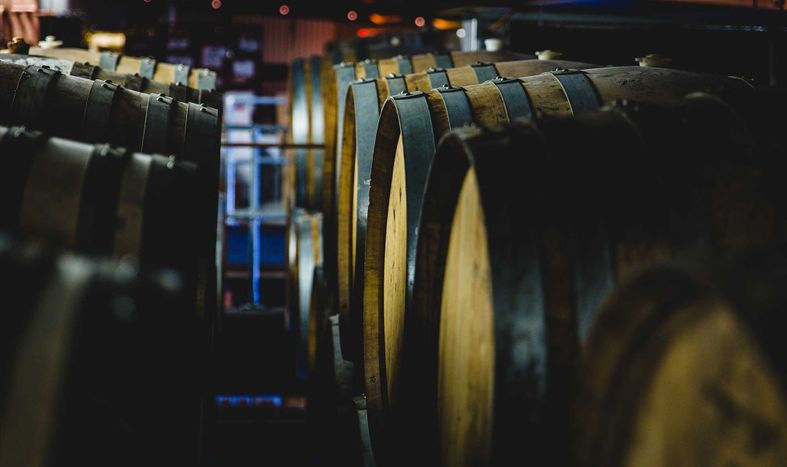 puncheons lined up in the Jester King Barrel Room puncheonsheader.jpg