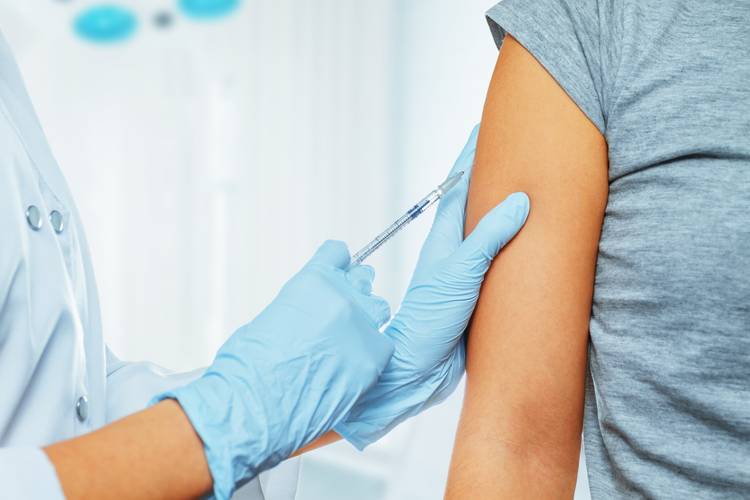 Woman receiving a vaccine HPV Vaccines