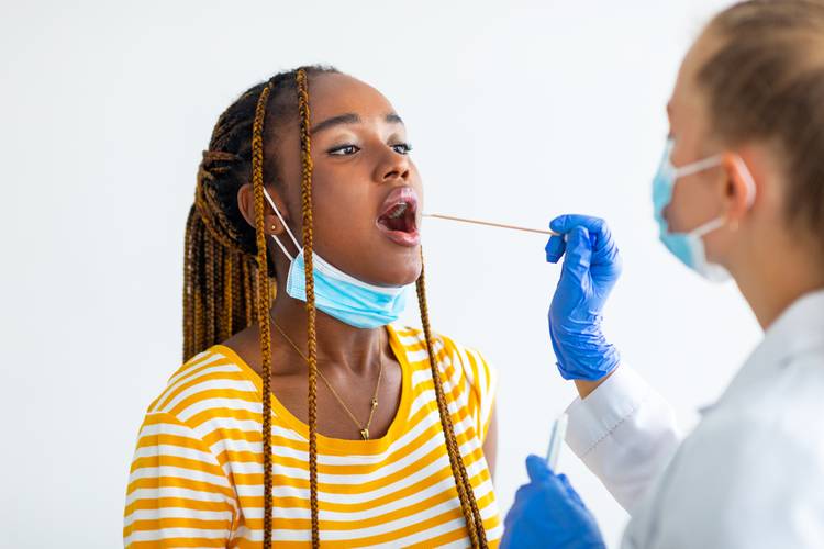 Woman Receiving Strep Test Strep Testing