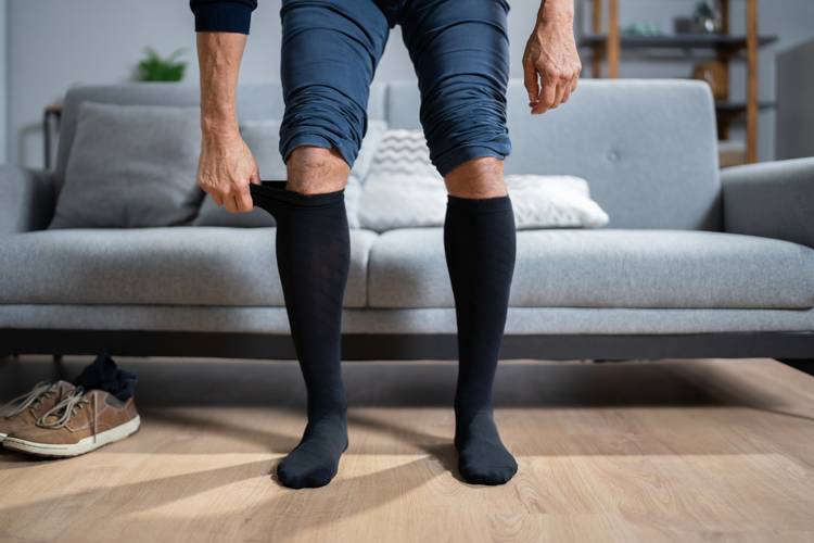 Man wearing compression stockings Your Local Resource for JOBST® in Modesto