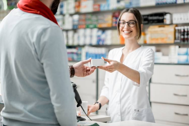 Pharmacist giving a person substance abuse medications Substance Abuse Medications