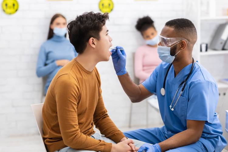 Patient receiving a strep test Flu & Strep Testing