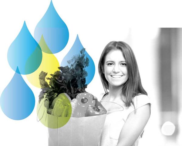 Smiling Woman Carrying Grocery Bag Filled with Produce and Water Drops Accent from Well Within Logo