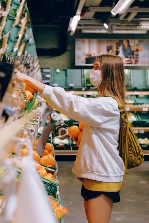 woman-in-white-long-sleeve-jacket-shopping-for-fruits-3962291.jpg