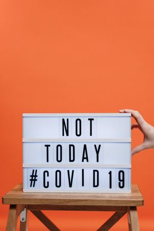 not-today-covid19-sign-on-wooden-stool-3952231.jpg