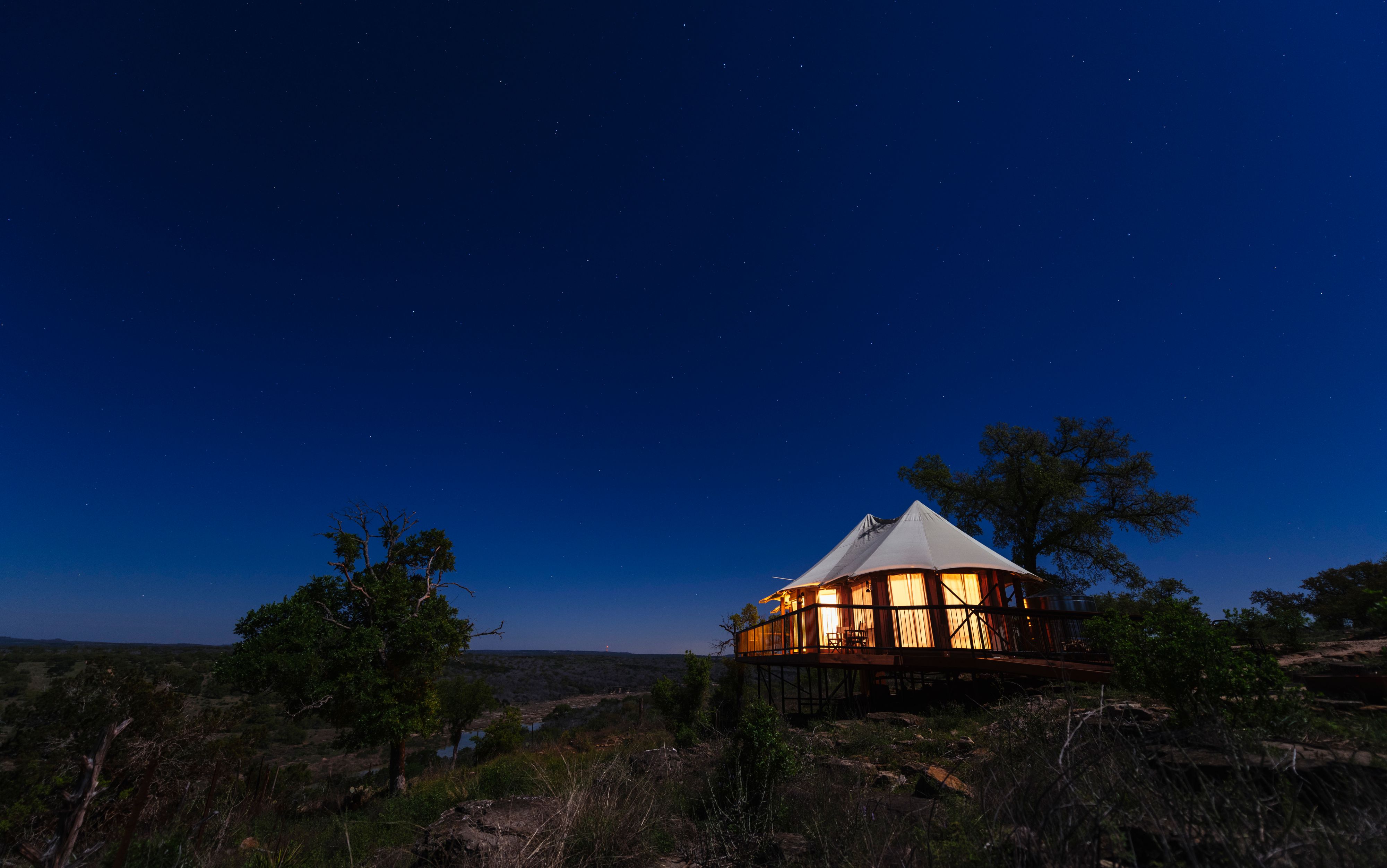 Nightime yurt at Walden Retreats Hill Country glamping