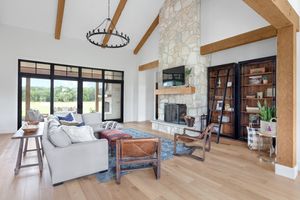 Open living room with limestone fireplace