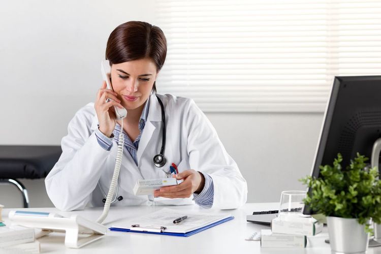 Pharmacist discussing medicine over the phone Medication Therapy Management