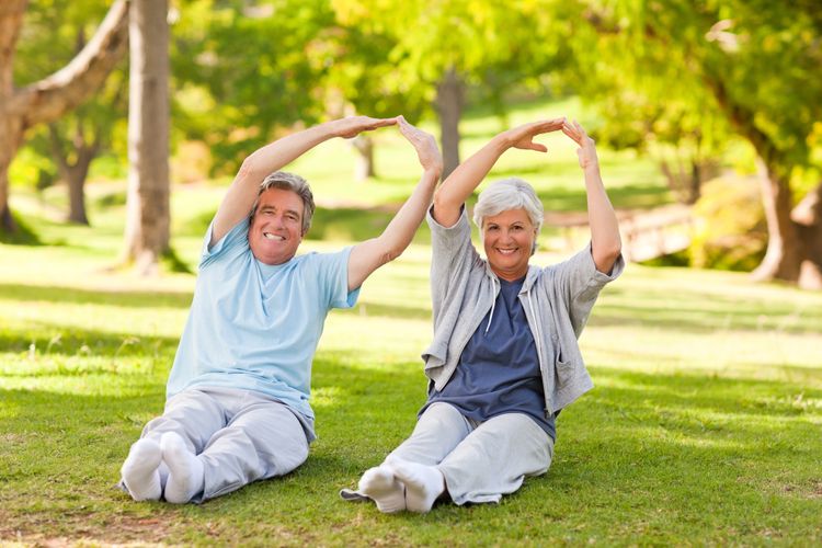 Elderly couple stretching in a park You are in charge