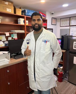 Hamza Akram in a pharmacist jacket Hamza Akram