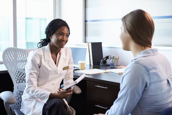 Pharmacist speaks to patient